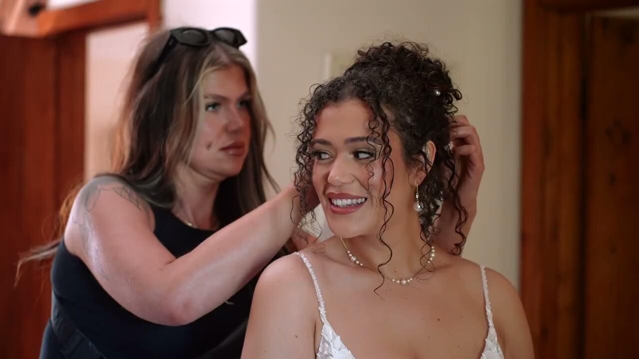 Professional wedding videography team filming a ceremony in the UK