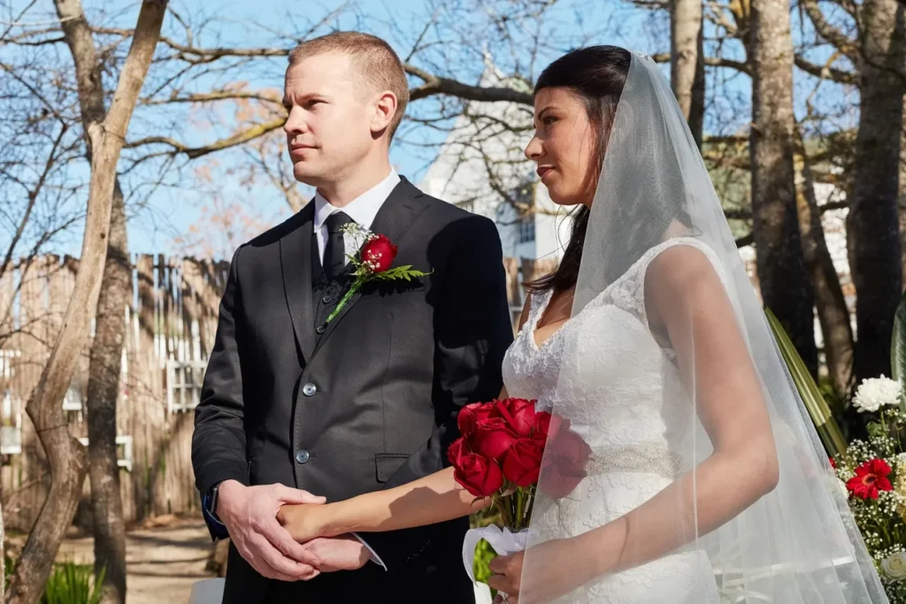Bride and groom smiling during ceremony – wedding videographer capturing moments