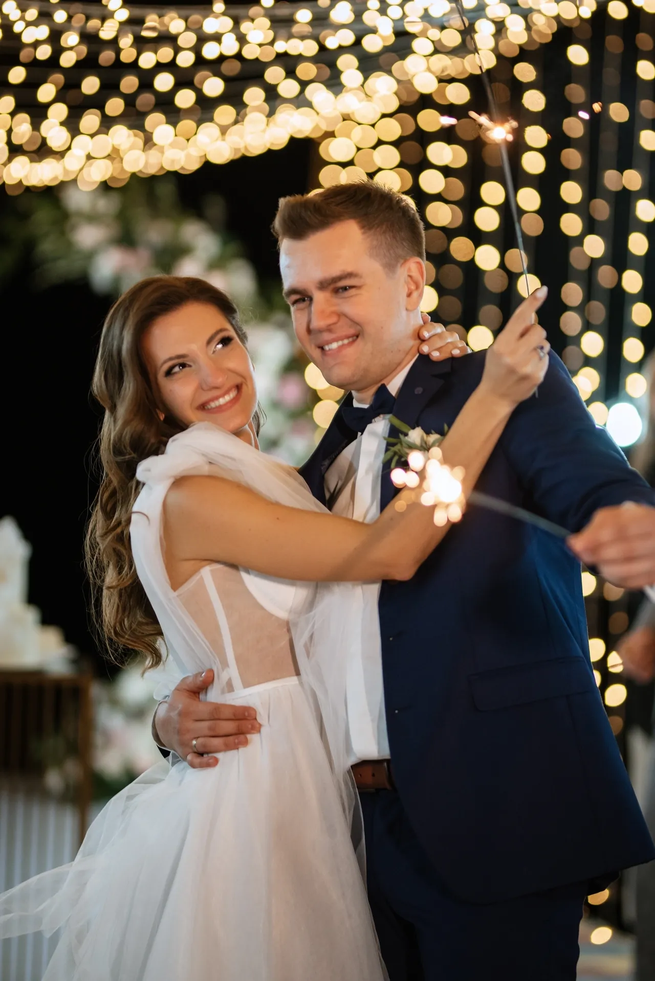Bride and groom sharing first dance — showing professional wedding videographer cost per hour in the UK.